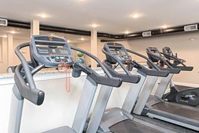 Hanover apartment for rent - Three treadmills are lined up in a row.