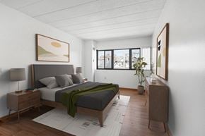 Pittsburgh apartment for rent - a bedroom with a bed and a window at Bates Hill Apartments Pittsburgh, PA.