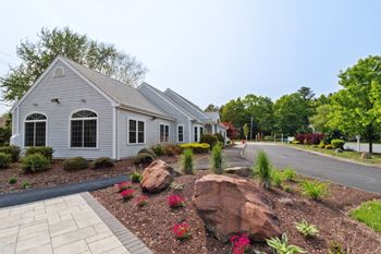 Mansfield meadows apartments leasing office with beautifully landscaped grounds.