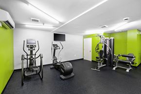 Stoughton apartment for rent - a gym with exercise equipment and green and white wallsat North Stoughton Village, Stoughton, MA