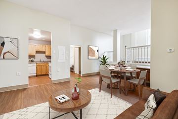 E. Boston apartment for rent - an open living room with a dining room table and a kitchen