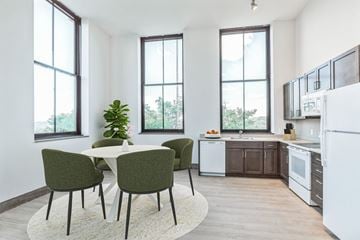 Pittsburgh apartment for rent - A kitchen with a table and chairs in front of a window.