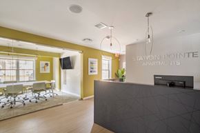 Mansfield apartment for rent - Leasing and Management Office  lobby with a reception desk and a table with chairs at Station Pointe Apartments, Mansfield, MA, 02048
