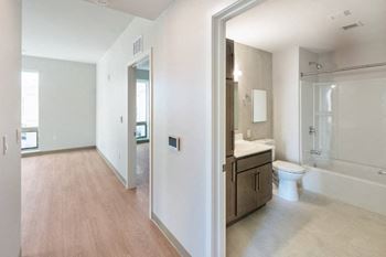 A bathroom with a toilet, sink, and bathtub