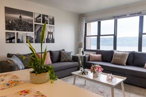 Yonkers apartment for rent - a living room with a large window and a view of a body of water at Dorado Apartments, Yonkers, NY