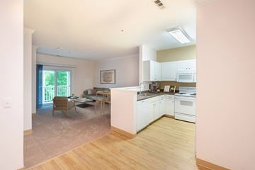 Abington apartment for rent - a view of a kitchen and living room with a table and chairs