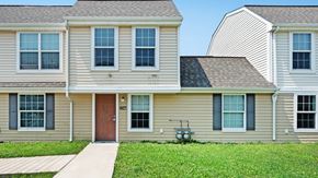 Niagara Falls apartment for rent - a house with a green lawn and a blue sky in the background  at Cornerstone Townhomes, New York, 14305