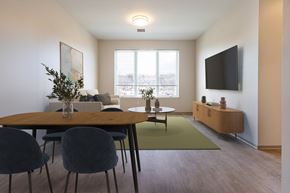 Menands apartment for rent - A modern dining room with a wooden table and chairs  at 35 Broadway Apartments, Menands, New York