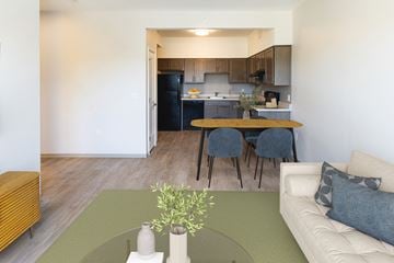 Menands apartment for rent - A kitchen with a table and chairs in the foreground.