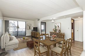 Pittsburgh apartment for rent - a living room and dining room with a wooden table and chairs at Highland Plaza Apartments, Pittsburgh, PA.