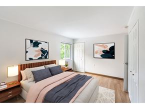 Worcester apartment for rent - a bedroom with a bed and two paintings on the wall