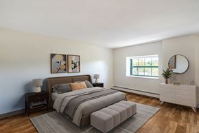 New Haven apartment for rent - A bedroom with a large bed and a white dresser at Brewery Square Apartments, New Haven , Connecticut