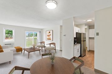 Canton apartment for rent - a living room and kitchen with a table and chairs