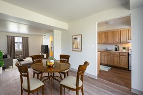 Hyde Park apartment for rent - Kitchen With Updated Cabinets and Flooring With Adjacent Dining Room at Georgetowne Homes Apartments, Massachusetts