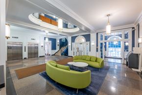 Boston apartment for rent - a lobby with couches and a table and a staircase  at 140 Clarendon, Boston, MA