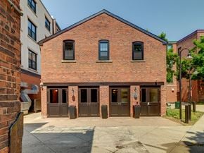 New Haven apartment for rent - the front of a brick building with three doors at Ninth Square Apartments, New Haven, CT