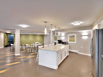 Westwood apartment for rent - a large kitchen with an island and a dining room with a table and chairs