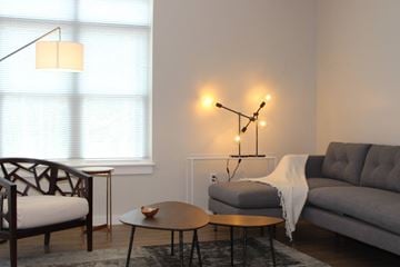 Duxbury apartment for rent - a living room with a couch and a chair and tables