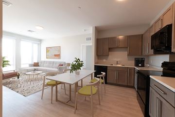 South Boston apartment for rent - A modern kitchen with a dining table and chairs.