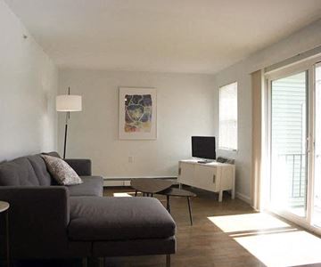 Duxbury apartment for rent - a living room with a couch and a tv