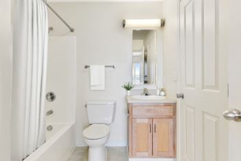 A bathroom with a toilet sink and shower