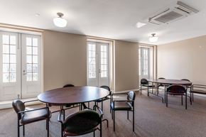 Schenectady apartment for rent - Community room with tables and chairs at 13 State Street, Schenectady NY
