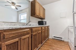 Dillsburg apartment for rent - kitchen with wood cabinets and white appliances  at Dillsburg Heights Apartments, Dillsburg, PA, 17019