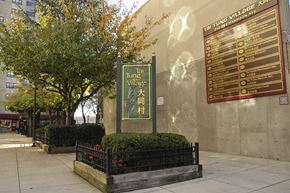 Boston apartment for rent - a sign for the times village on the side of a building at Tai Tung Village, Boston, MA