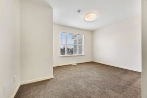 Watertown apartment for rent - a bedroom with white walls and carpet at Creekwood Apartments, Watertown, NY