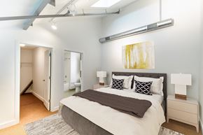 North Easton apartment for rent - a bedroom with a large bed and a closetat Ames Shovel Works Apartments, North Easton, Massachusetts