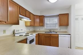 Watertown apartment for rent - Kitchen Layout with Updated Modern Appliances, Wooden Cabinetry  at Summit Wood Apartments, Watertown, 13601