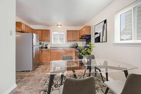 Monroe Township apartment for rent - a kitchen and dining room with a glass table and chairs