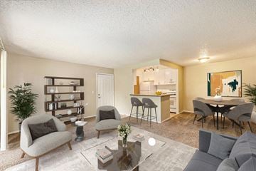 Monroe apartment for rent - a living room with a couch and chairs and a kitchen with a table