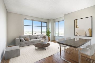 Grand Rapids apartment for rent - a living room with a couch and a dining table