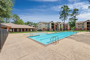 Spring apartment for rent - A swimming pool in front of apartment buildings.