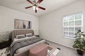 San Marcos apartment for rent - a bedroom with a bed and a ceiling fan