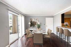 Monroe apartment for rent - a dining room with a table and chairs and a door to a balcony