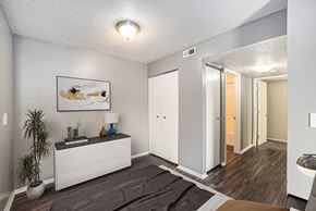 Monroe apartment for rent - a bedroom with a bed and a closet and a mirror