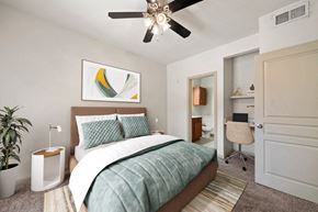 San Antonio apartment for rent - a bedroom with a bed and a ceiling fan