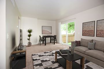 Monroe Township apartment for rent - a living room with a couch and a table and a tv