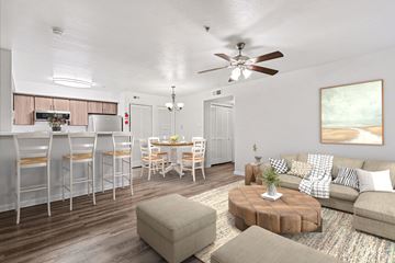 Spring apartment for rent - A living room with a brown coffee table and a white couch.