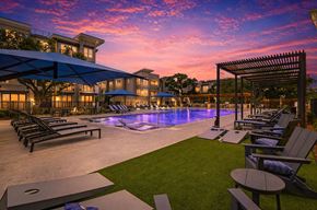 San Antonio apartment for rent - A beautiful outdoor swimming pool area with lounge chairs and a pergola.