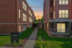 Madison apartment for rent - A building with a sign that says "LONGFELLOW LOFTS" in front of it.