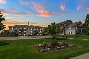 Madison apartment for rent - A building with a garden in front of it.