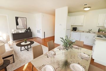 Grand Rapids apartment for rent - a living room and dining room with a table and chairs