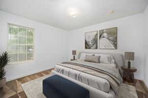 Salisbury apartment for rent - a bedroom with a bed and two paintings on the wall