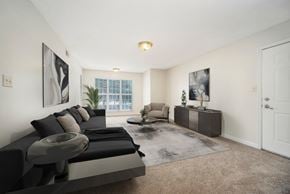 Greensboro apartment for rent - the living room of an apartment with a couch and a table