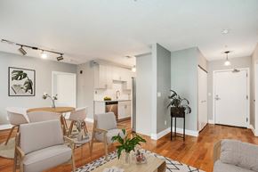 Grand Rapids apartment for rent - A living room with a dining table and chairs.
