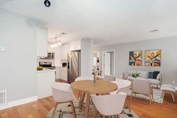 Grand Rapids apartment for rent - a living room and dining room with a table and chairs