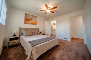 Flagstaff apartment for rent - A bedroom with a bed, nightstands, and a painting on the wall.